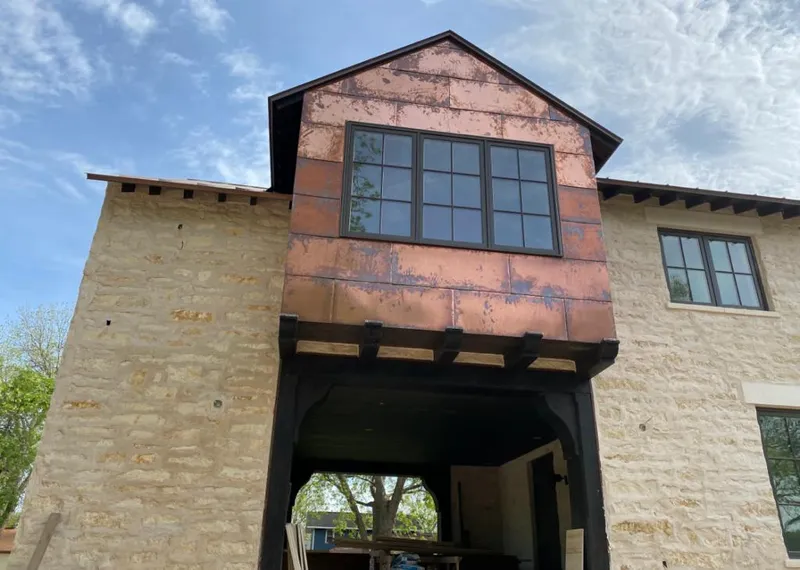Copper metal panel facade on a stone building for Metal Roof Coating in Mountain Home